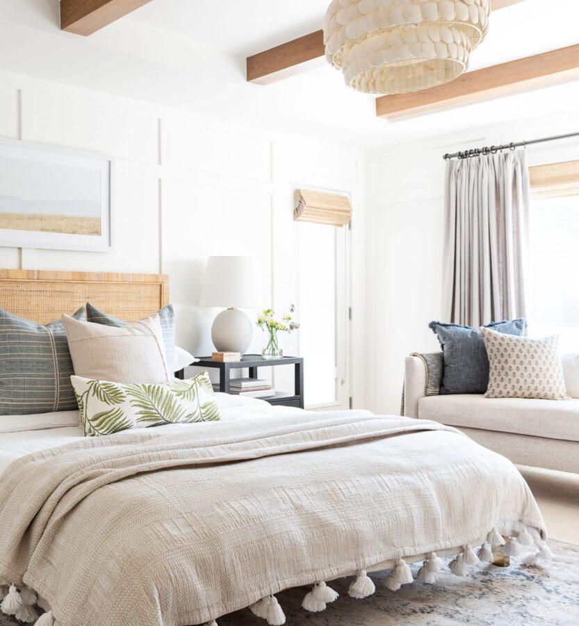 Studio McGee Bedroom with bamboo shades, scallop light fixture, mixed metals, beige curtains
