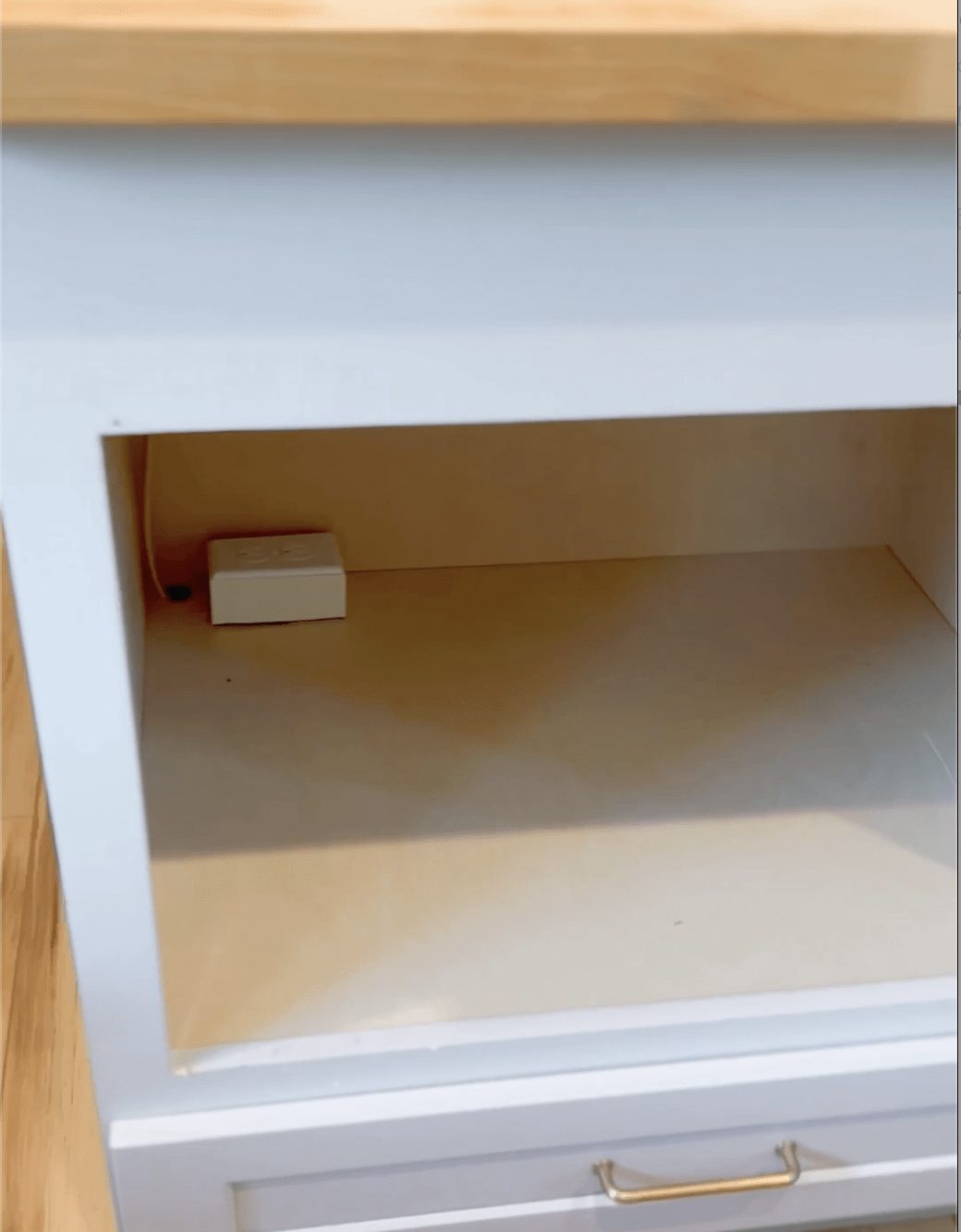 Microwave outlet inside cabinet opening